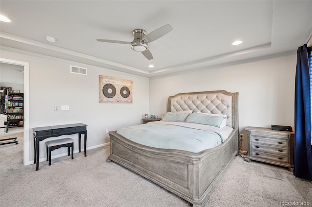 bedroom featuring carpet flooring, recessed lighting, visible vents, and a raised ceiling