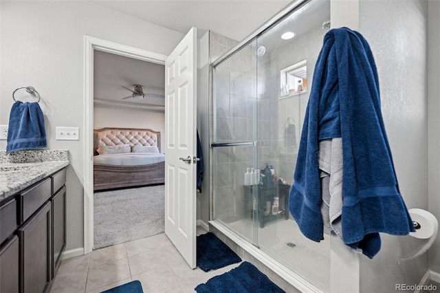 full bath featuring ensuite bathroom, tile patterned flooring, a stall shower, and vanity