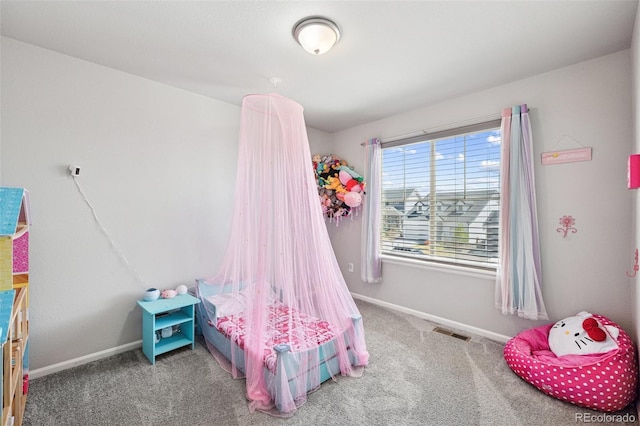 bedroom featuring visible vents, baseboards, and carpet floors