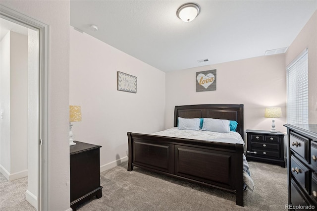 bedroom featuring carpet floors, baseboards, and visible vents