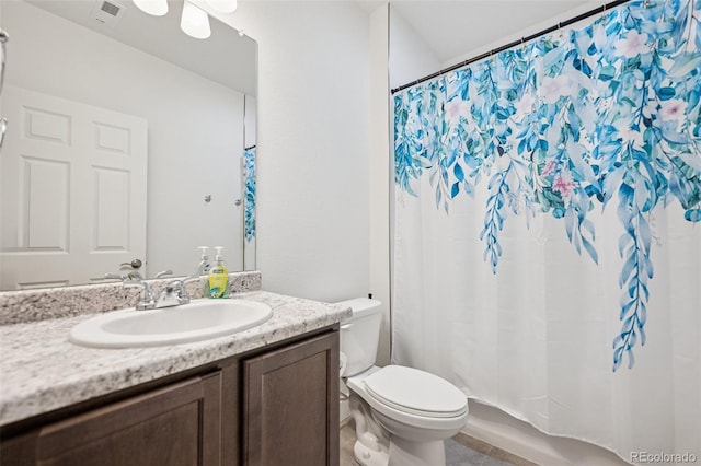 bathroom with toilet, a shower with curtain, visible vents, and vanity