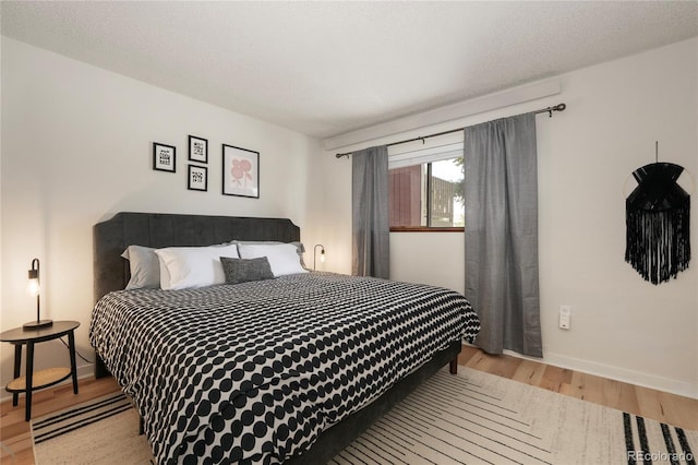 62 County Road 838 Unit 21-4, Fraser, CO 80442 - bedroom featuring light wood-type flooring and baseboards