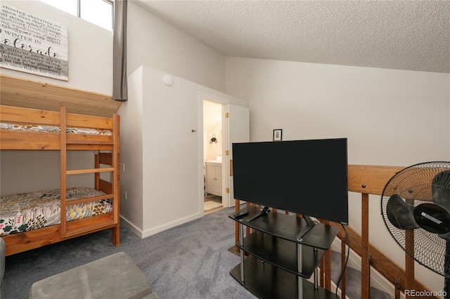 62 County Road 838 Unit 21-4, Fraser, CO 80442 - carpeted bedroom with lofted ceiling, a textured ceiling, and baseboards