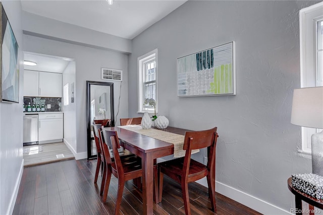 dining space featuring dark hardwood / wood-style floors