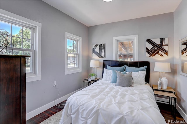 bedroom featuring dark hardwood / wood-style floors