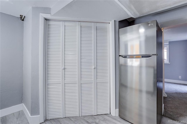 interior space with stainless steel refrigerator and light wood-type flooring