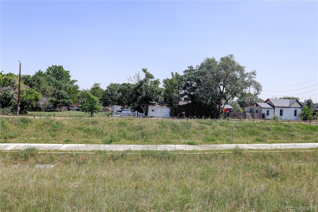 view of yard with a rural view