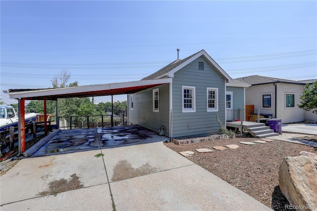 view of front facade with a carport