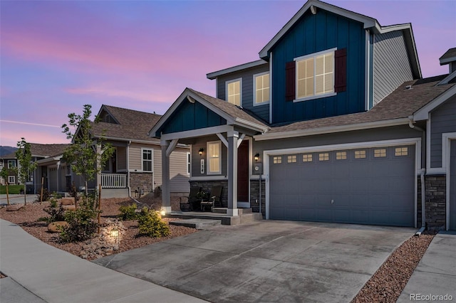 craftsman house featuring covered porch and a garage