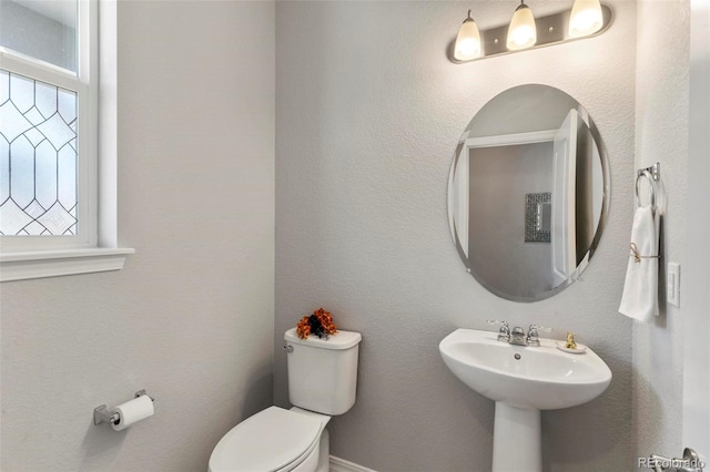 bathroom featuring sink and toilet