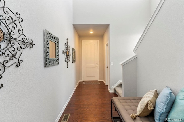 hallway featuring dark hardwood / wood-style floors