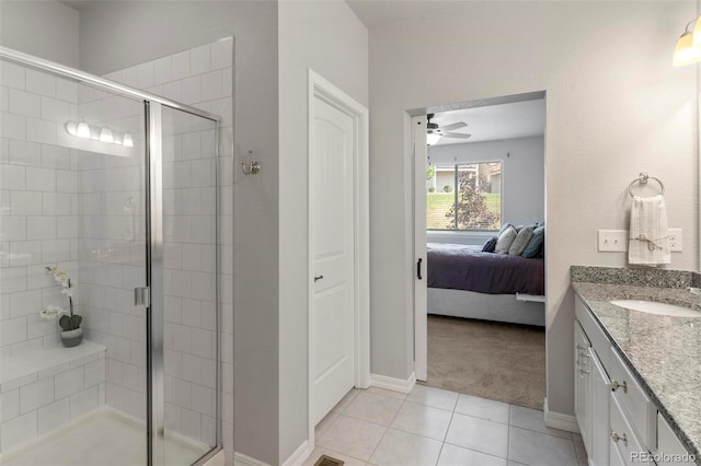 bathroom with vanity, tile patterned floors, an enclosed shower, and ceiling fan