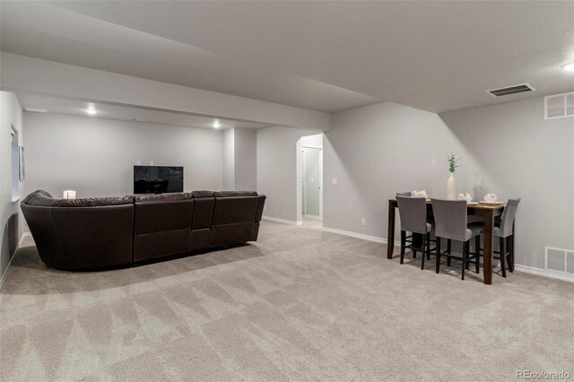 living room with light colored carpet