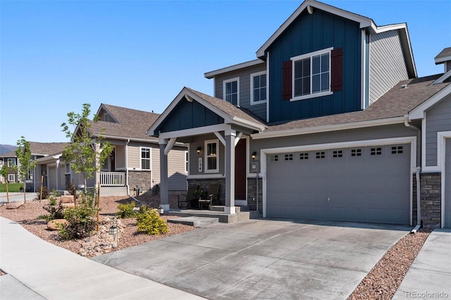 craftsman-style house featuring covered porch and a garage