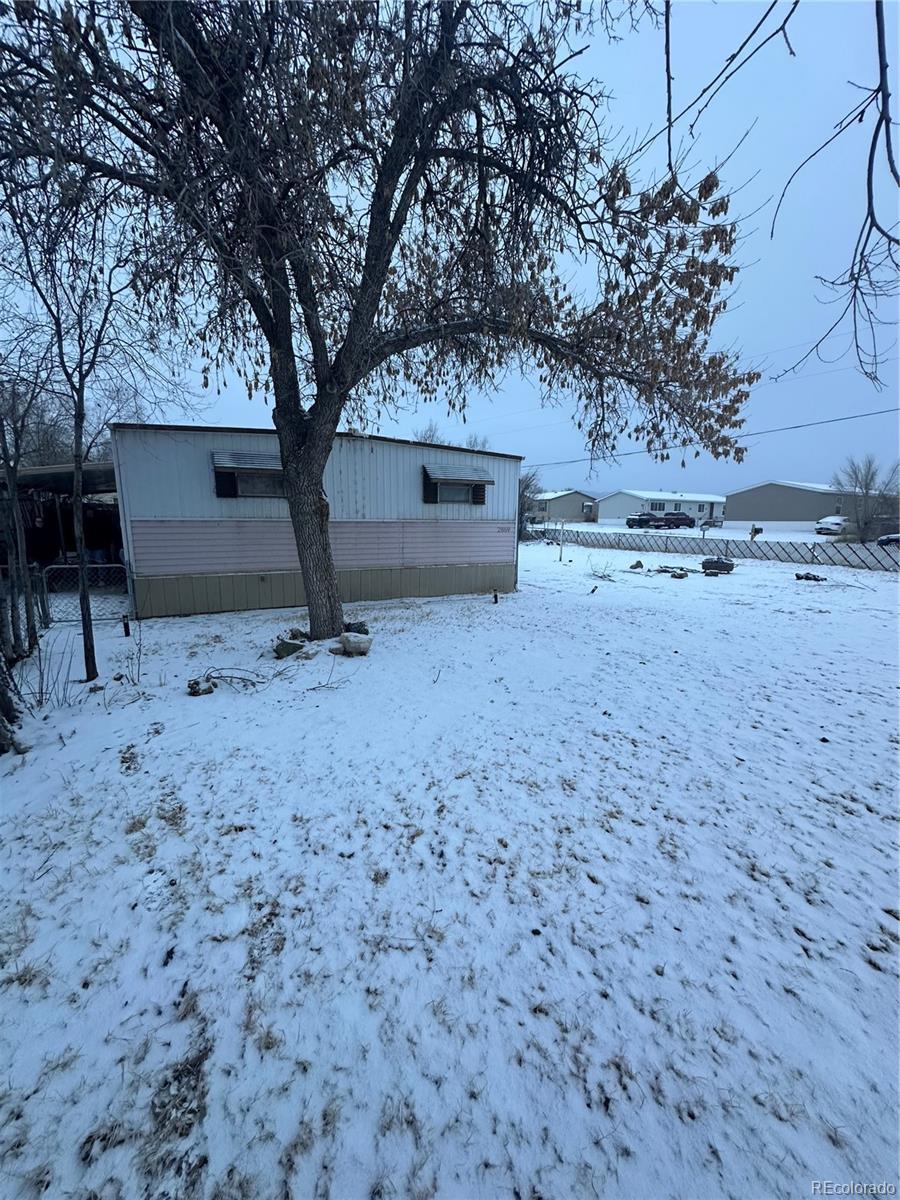 view of snow covered property