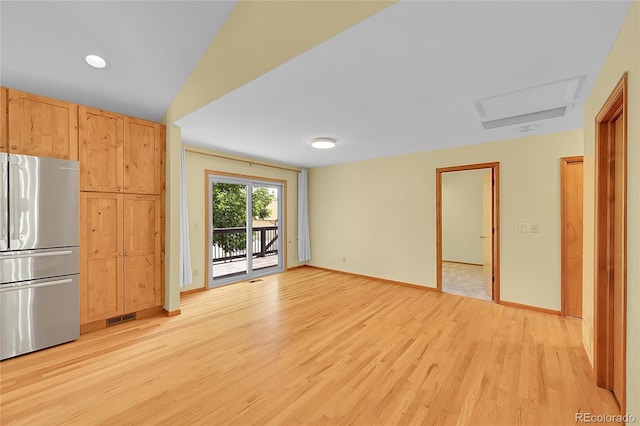 1624 Daphne St, Broomfield, CO 80020 - unfurnished living room with light wood-type flooring and baseboards