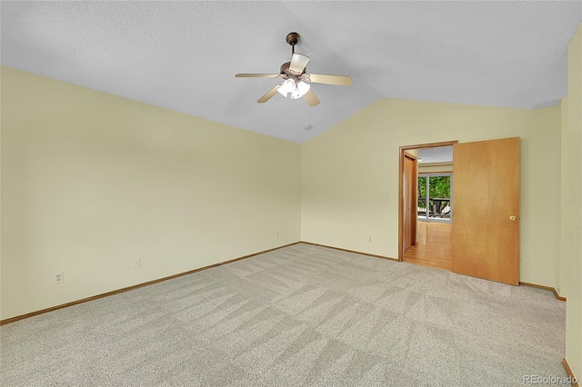 1624 Daphne St, Broomfield, CO 80020 - empty room featuring ceiling fan, light colored carpet, vaulted ceiling, and a textured ceiling