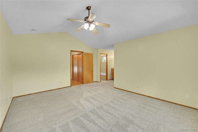 1624 Daphne St, Broomfield, CO 80020 - unfurnished room featuring ceiling fan, lofted ceiling, light colored carpet, and a textured ceiling