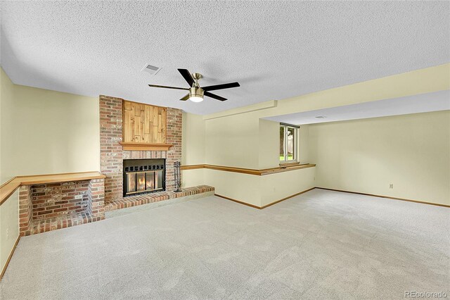 1624 Daphne St, Broomfield, CO 80020 - unfurnished living room featuring a ceiling fan, carpet, a brick fireplace, and a textured ceiling