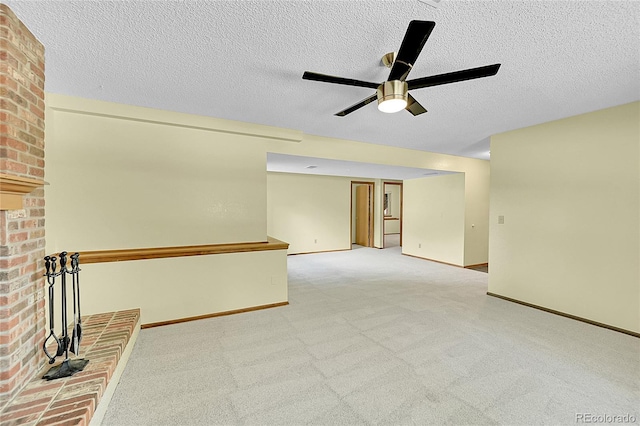 1624 Daphne St, Broomfield, CO 80020 - carpeted spare room featuring a ceiling fan, a fireplace, and a textured ceiling