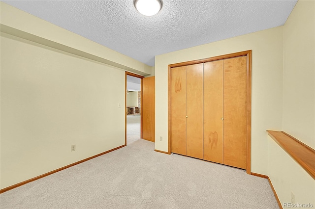 1624 Daphne St, Broomfield, CO 80020 - unfurnished bedroom with carpet, a closet, and a textured ceiling