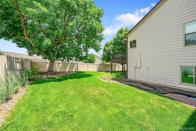 1624 Daphne St, Broomfield, CO 80020 - fenced backyard featuring a wooden deck