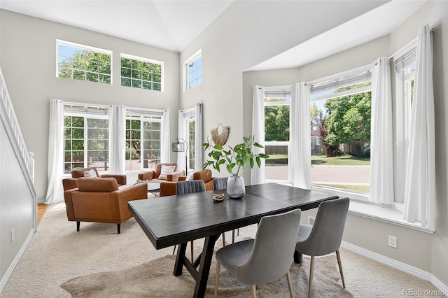4501 Whitehall Ln, Highlands Ranch, CO 80126 - dining area with light colored carpet and a high ceiling