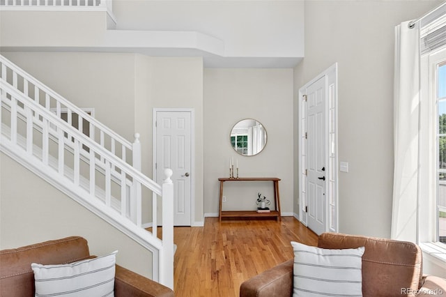 4501 Whitehall Ln, Highlands Ranch, CO 80126 - entrance foyer featuring light wood-style floors and stairway