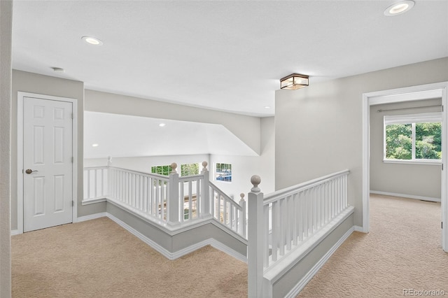 4501 Whitehall Ln, Highlands Ranch, CO 80126 - corridor featuring carpet flooring, an upstairs landing, and recessed lighting