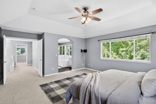 4501 Whitehall Ln, Highlands Ranch, CO 80126 - bedroom featuring arched walkways, light colored carpet, connected bathroom, and a ceiling fan