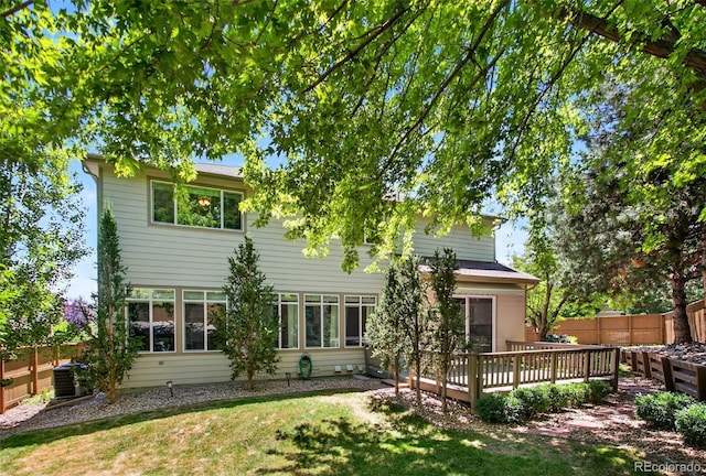 4501 Whitehall Ln, Highlands Ranch, CO 80126 - rear view of house with a deck and a fenced backyard