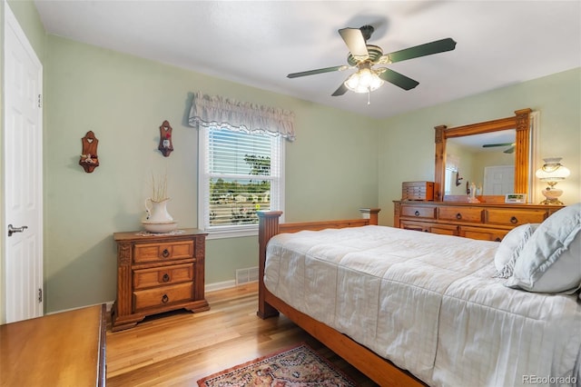 1317 E Uintah St, Colorado Springs, CO 80909 - bedroom with light wood-style floors, a ceiling fan, and baseboards