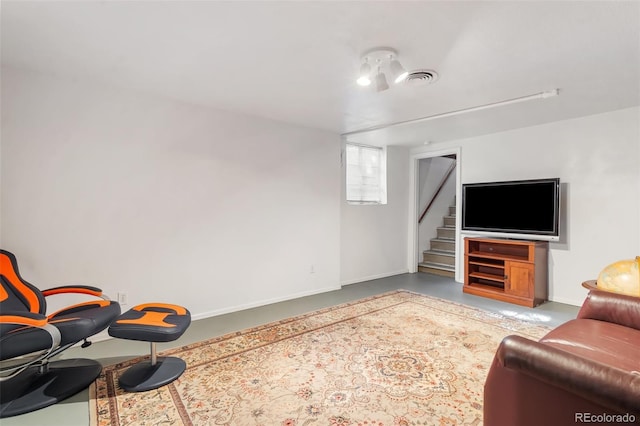 1317 E Uintah St, Colorado Springs, CO 80909 - living room with stairway, concrete floors, and baseboards