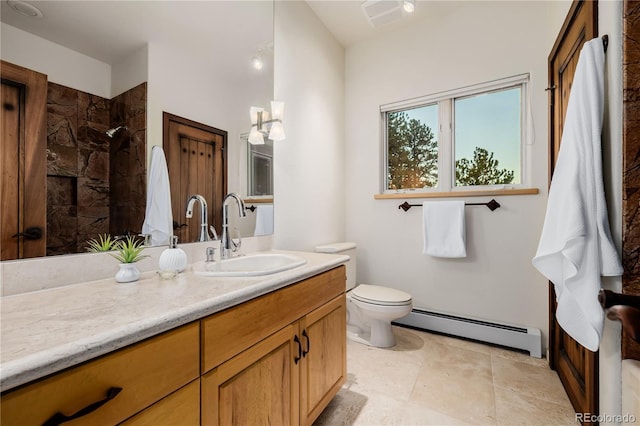 bathroom featuring vanity, toilet, tiled shower, and baseboard heating