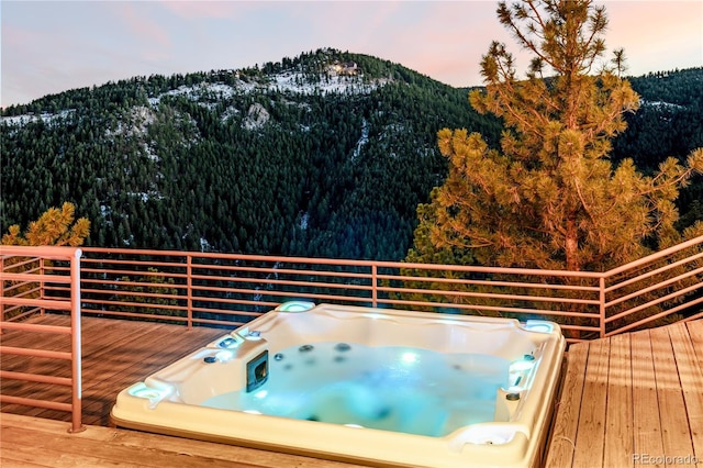 deck at dusk with a mountain view