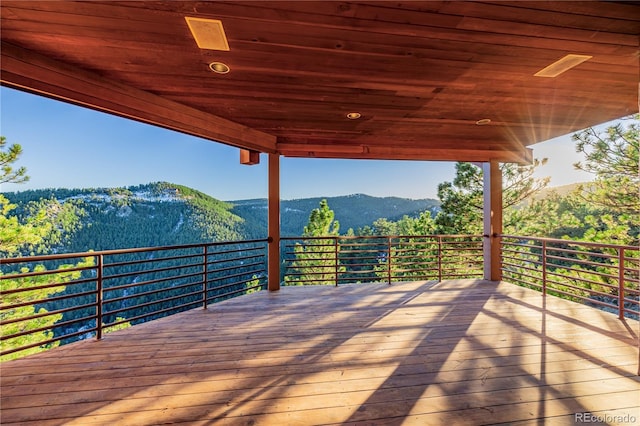 wooden deck featuring a mountain view