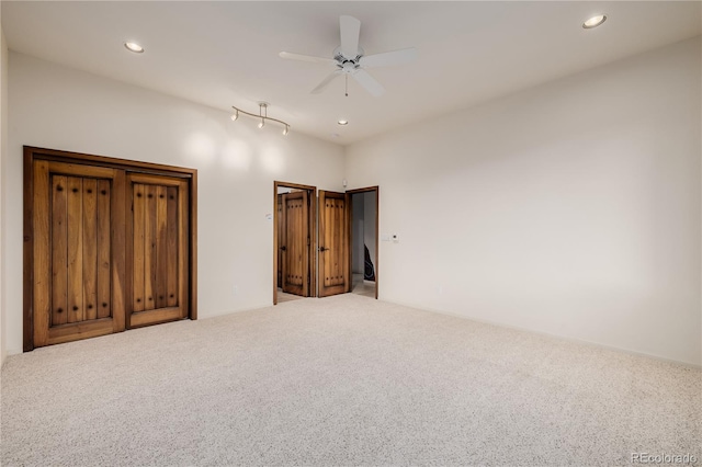 unfurnished bedroom with carpet and ceiling fan