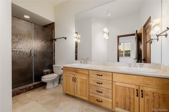 bathroom with vanity, toilet, and a shower with shower door