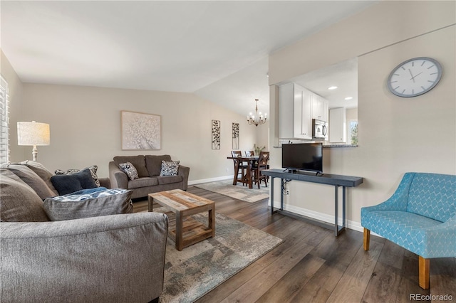 living area with baseboards, lofted ceiling, dark wood-style floors, a notable chandelier, and recessed lighting