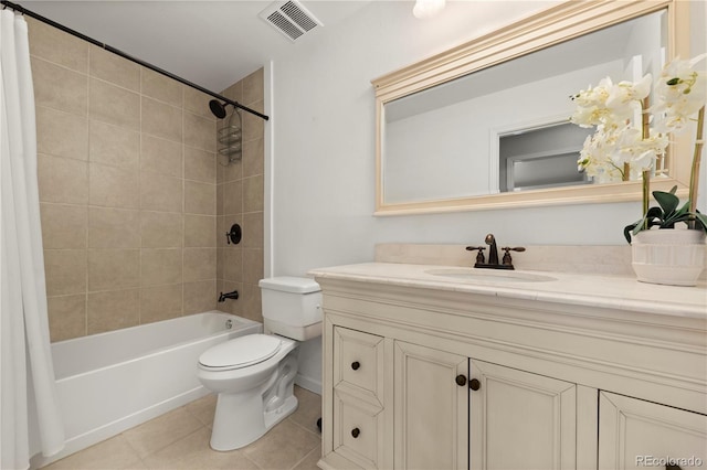 bathroom featuring visible vents, toilet, shower / bath combo with shower curtain, vanity, and tile patterned flooring