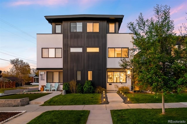 3658 Quivas St, Denver, CO 80211 - view of front of property featuring board and batten siding and a lawn