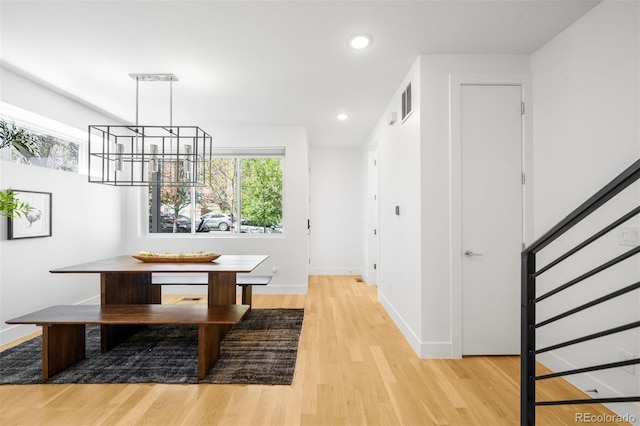 3658 Quivas St, Denver, CO 80211 - dining room with light wood-type flooring, a chandelier, baseboards, recessed lighting, and stairway