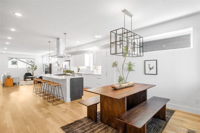 3658 Quivas St, Denver, CO 80211 - dining space featuring light wood finished floors, recessed lighting, and baseboards