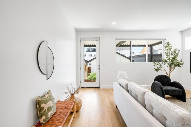 3658 Quivas St, Denver, CO 80211 - living room featuring light wood-type flooring, recessed lighting, and baseboards