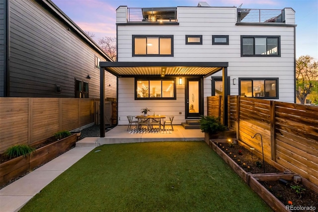 3658 Quivas St, Denver, CO 80211 - back of property with a vegetable garden and a patio area