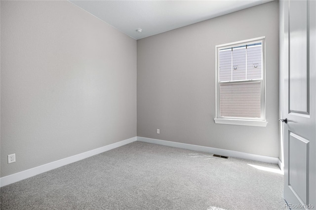 unfurnished room with carpet flooring