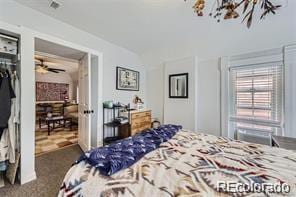 bedroom featuring dark colored carpet