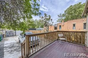 wooden terrace featuring area for grilling