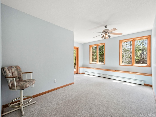 48 Warren Rd, Black Hawk, CO 80422 - interior space with baseboards, baseboard heating, ceiling fan, and carpet floors