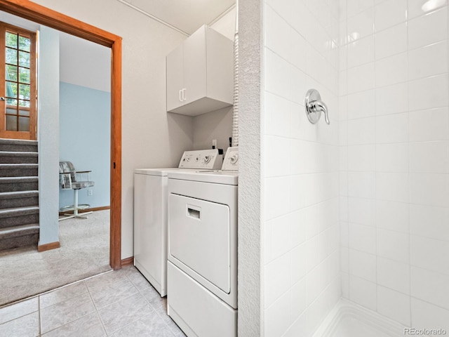 48 Warren Rd, Black Hawk, CO 80422 - laundry room featuring light colored carpet, washer and clothes dryer, and light tile patterned floors